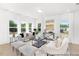 Living room with gray sectional sofa and plenty of natural light at 216 Horseshoe Pl # 25, Angier, NC 27501