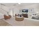 Open concept living room features modern décor, comfortable seating, and lots of natural light at 216 Horseshoe Pl # 25, Angier, NC 27501