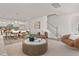 Open-concept living area with modern furnishings, a stylish coffee table, and dining area views at 216 Horseshoe Pl # 25, Angier, NC 27501