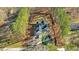 Aerial view of house, pond, and wooded area at 225 Rudd Rd, Youngsville, NC 27596