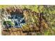 Aerial view of house nestled in wooded area at 225 Rudd Rd, Youngsville, NC 27596