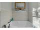 Relaxing bathtub with a view and bright natural light at 225 Rudd Rd, Youngsville, NC 27596