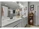 Double vanity bathroom with large mirror and updated fixtures at 225 Rudd Rd, Youngsville, NC 27596