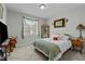 Bright bedroom with a comfortable bed and large window at 225 Rudd Rd, Youngsville, NC 27596