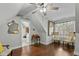 Bonus room with hardwood floors, a desk and built-in shelves at 225 Rudd Rd, Youngsville, NC 27596