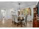 Spacious dining area featuring a large table, hardwood floors, and natural light at 225 Rudd Rd, Youngsville, NC 27596