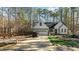 White farmhouse exterior with driveway and landscaping at 225 Rudd Rd, Youngsville, NC 27596