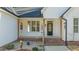 Front entrance with brick steps and hanging planters at 225 Rudd Rd, Youngsville, NC 27596