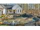 Landscaped front yard with a pond and waterfall feature at 225 Rudd Rd, Youngsville, NC 27596