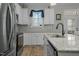 Updated kitchen, featuring stainless steel appliances and granite island at 225 Rudd Rd, Youngsville, NC 27596