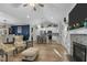 Open living area with hardwood floors and fireplace at 225 Rudd Rd, Youngsville, NC 27596