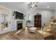 Spacious living room with fireplace and built in shelving at 225 Rudd Rd, Youngsville, NC 27596