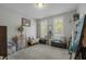 Cozy sitting room with two windows and ample natural light at 225 Rudd Rd, Youngsville, NC 27596