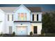 Two-story home with white siding, gray roof, and a two-car garage at 242 Broomside Ave, Raleigh, NC 27603