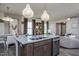 Open concept kitchen with island, granite countertops, and breakfast area at 242 Broomside Ave, Raleigh, NC 27603