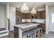 Modern kitchen with island, stainless steel appliances, and granite countertops at 242 Broomside Ave, Raleigh, NC 27603