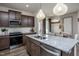 Eat-in kitchen with stainless steel appliances and granite island at 242 Broomside Ave, Raleigh, NC 27603