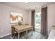 Charming home office with a wooden desk and large window at 242 Broomside Ave, Raleigh, NC 27603