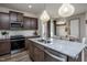 Island kitchen features stainless steel appliances and granite countertops at 246 Broomside Ave, Raleigh, NC 27603