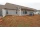 Gray vinyl-sided home with a patio and fenced backyard at 2530 Friedland Pl # 104, Raleigh, NC 27617