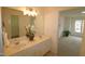 Double vanity bathroom with a view into bedroom at 2530 Friedland Pl # 104, Raleigh, NC 27617