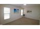 Bright bedroom with neutral walls and carpet at 2530 Friedland Pl # 104, Raleigh, NC 27617