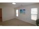 Bright bedroom with large window and ceiling fan at 2530 Friedland Pl # 104, Raleigh, NC 27617