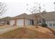 Two-car garage and attractive brick front at 2530 Friedland Pl # 104, Raleigh, NC 27617