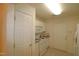 Efficient kitchen with white cabinets and granite counters at 2530 Friedland Pl # 104, Raleigh, NC 27617