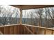Deck with a view of wooded area and distant homes at 286 W Beech Slope Ct, Chapel Hill, NC 27517