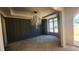 Dining room with wainscotting, decorative chandelier, and lots of natural light at 286 W Beech Slope Ct, Chapel Hill, NC 27517