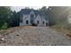 New construction two-story home with modern design elements and a wooded backdrop at 286 W Beech Slope Ct, Chapel Hill, NC 27517