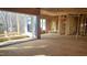 Spacious living room under construction with large sliding glass doors leading to a deck at 286 W Beech Slope Ct, Chapel Hill, NC 27517