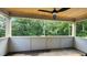 A covered patio with a wooden ceiling and a ceiling fan overlooking the backyard at 286 W Beech Slope Ct, Chapel Hill, NC 27517