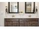 Double vanity bathroom with dark wood cabinets and quartz countertops at 313 Umstead St, Sanford, NC 27330