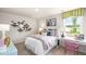 Bright bedroom with window, desk, and colorful bedding at 313 Umstead St, Sanford, NC 27330