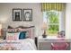 Cozy bedroom with window, desk, and whimsical decor at 313 Umstead St, Sanford, NC 27330