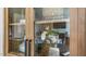 Glass-front cabinet displays dishes and decorative items at 313 Umstead St, Sanford, NC 27330