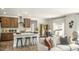 Open-concept kitchen and living area with island and hardwood floors at 313 Umstead St, Sanford, NC 27330