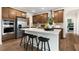 Modern kitchen featuring a large island with seating and stainless steel appliances at 313 Umstead St, Sanford, NC 27330