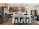 Modern kitchen with stainless steel appliances, an island, and wood cabinets at 313 Umstead St, Sanford, NC 27330