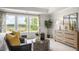 Main bedroom with sitting area, large windows, and dresser at 313 Umstead St, Sanford, NC 27330