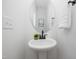 Clean bathroom with pedestal sink and modern fixtures at 35 Mable Court # 3, Lillington, NC 27546