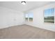 Bright bedroom with two windows and neutral carpet at 35 Mable Court # 3, Lillington, NC 27546