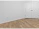 Simple bedroom with wood flooring and double doors at 35 Mable Court # 3, Lillington, NC 27546