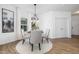 Bright dining room with round table, four chairs, and hardwood floors at 35 Mable Court # 3, Lillington, NC 27546