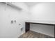 Laundry room with shelving, countertop, and wood flooring at 35 Mable Court # 3, Lillington, NC 27546