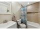 Clean bathroom with a shower/tub and patterned curtain at 507 Hawkins Ave, Sanford, NC 27330