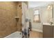 Bathroom with beige tile and a shower/tub at 507 Hawkins Ave, Sanford, NC 27330