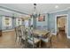 Bright dining room featuring a large table and chandelier at 507 Hawkins Ave, Sanford, NC 27330
